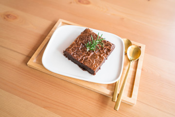 Chocolate brownies on wooden surface