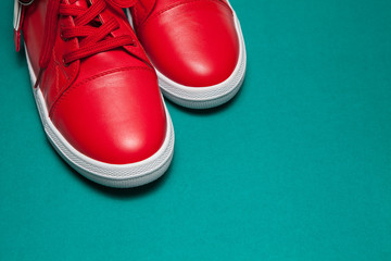 One sport red sneakers on blue background