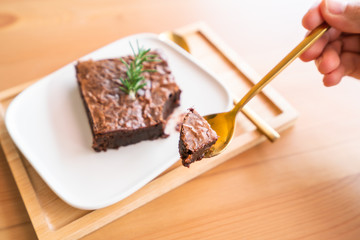 Chocolate brownies on wooden surface