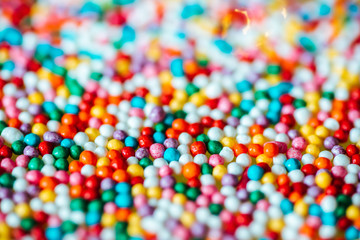 Fototapeta na wymiar multicolored candy on a green background
