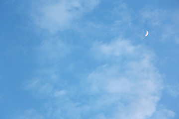 Moon on light blue sky, horizontal picture