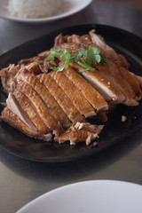 steamed duck meat in Chinese brown soup on plate
