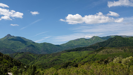 Naklejka premium Green mountain landscape on a blue sunny sky on a sunny day in Catalonia mountains