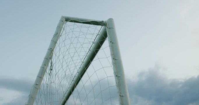 Soccer ball scores a hits the post. 4K UHD 60 FPS SLOW MOTION