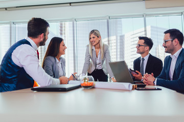  Group of young business people working together in creative office.