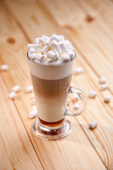 cup of coffee on the wooden background