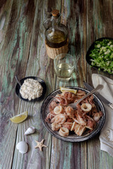 Fried calamari on a wooden table