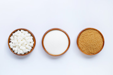 Wooden bowl with sugar on white background.