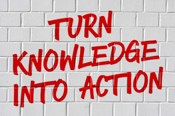 Graffiti on a brick wall - Turn knowledge into action
