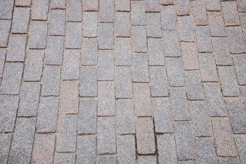 Sand-colored bricks. Stone pavement on the ground for street road. Sidewalk, driveway, cobblestones, sidewalk square pattern. textured background