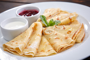 pancakes with sour cream and berry sauce