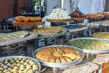 Traditional Turkish sweets in the open buffet in a hotel in Turkey
