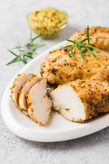 Baked mustard honey chicken breasts with cherry tomatoes. Selective focus, space for text.