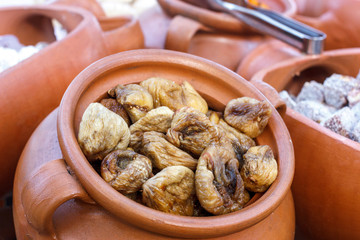Dry figs in a large clay pot