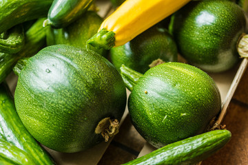 Many green healthy vegetables. Fresh zucchinis with great taste..Beautiful different vegetables varieties for a vegetarian food.