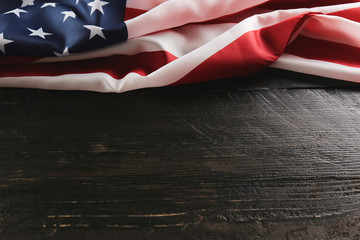 Patriotic composition w/ ruffled American flag, wood planks background. United States of America...