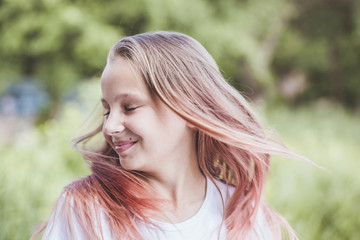 girl with ash-pink hair waving her head