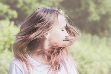 Beautiful girl waving her head