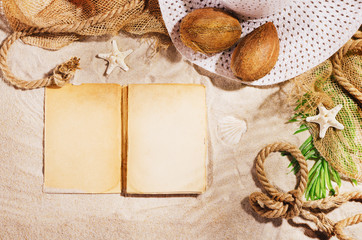 Summer background with copy space. Top view of sandy beach with visible sand texture and exotic accessories. Backdrop for products and mockup.