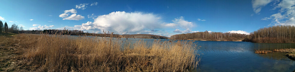 panorama of a beautiful lake and blue sky with clouds