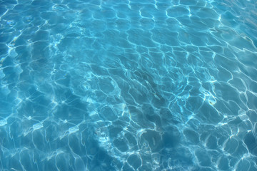 Fototapeta na wymiar blue water in the pool small waves sea ocean