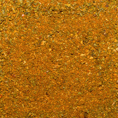 Photo of closeup texture of orange spice for meat and chicken and other food, background
