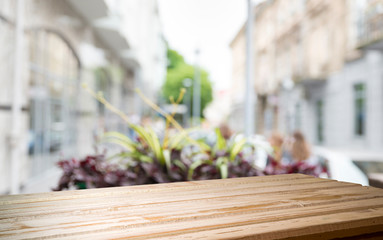 Empty of wood table top on blur of curtain with window view green from tree garden background.For montage product display or design key visual layout