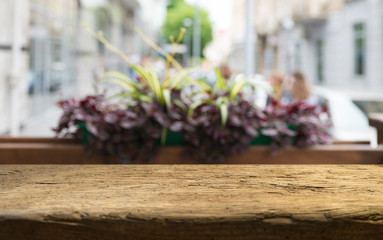 Empty of wood table top on blur of curtain with window view green from tree garden background.For montage product display or design key visual layout