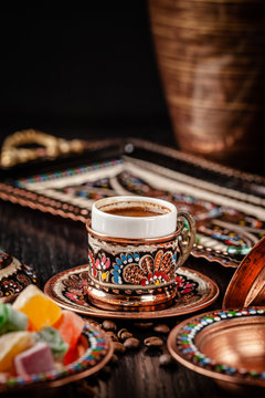 The concept of Turkish cuisine. Turkish brewed black coffee. Beautiful coffee serving in the restaurant. Background image. copy space