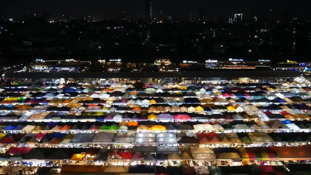 Bangkok Train Night Market. It provides the visitors with a feeling of carnival night bazaar. The market has many stalls selling different things such as street foods, clothes, antique things and soon