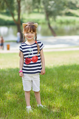 Young girl posing outdoors