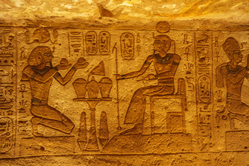 Fototapeta na wymiar Bas relief of Ramesses II as pharaoh and god in the Great Temple of Abu Simbel