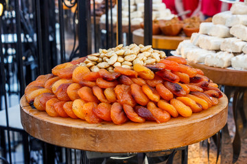 Whole dried apricots with nuts in pottery