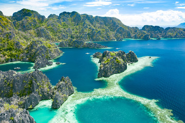 Fototapeta premium Aerial view of beautiful lagoons and limestone cliffs of Coron, Palawan, Philippines