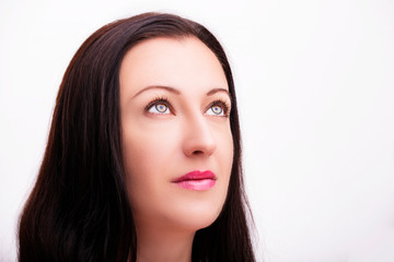 Fototapeta premium A portrait of beautiful face with beautiful eyes - isolated on white.