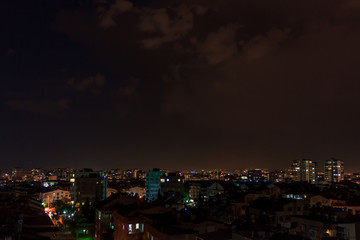 Fototapeta na wymiar Night sky over the city - Antalya, Turkey, 06.08.2019