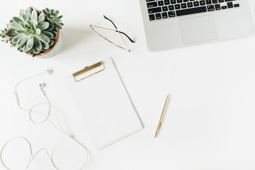 Home office desk workspace with blank copy space clipboard, laptop, headphones, glasses, succulent on white background. Flat lay, top view modern minimalist blog hero header template.
