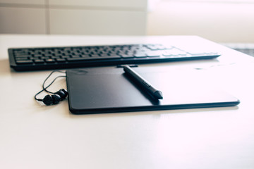 drawing tablet with pen, keyboard and earphones