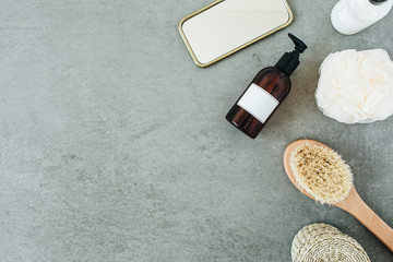 Bath products: liquid soap, brush, mirror, sponge. Spa composition. Flat lay, top view.