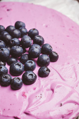 Fresh blueberry cheesecake on the rustic background. Selective focus. Shallow depth of field.