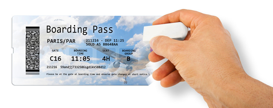 Human hand erases an airline ticket - Flight cancelled concept image - The image is totally invented and does not contain under copyright parts