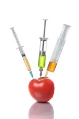 Injection into a tomato, GMO concept, pesticides, poisons. White background.