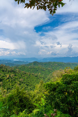 Blue sky high peak mountains fog hills mist scenery national park views at Phu Tub Berk, Khao Koh, Phetchabun Province, Thailand