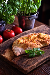 homemade calzone on a wooden board