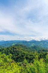 Obraz premium Blue sky high peak mountains fog hills mist scenery national park views at Phu Tub Berk, Khao Koh, Phetchabun Province, Thailand