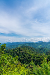 Blue sky high peak mountains fog hills mist scenery national park views at Phu Tub Berk, Khao Koh, Phetchabun Province, Thailand