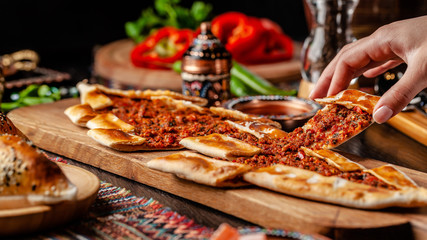 Traditional Turkish cuisine. Turkish pizza Pita with meat. Turk Pidesi or  Sucuk Pide. Beautiful...