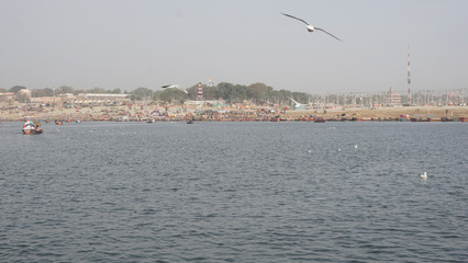 Fototapeta na wymiar Flying birds on River Ganga and River Yamuna Sangam Prayagraj