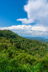 Blue sky high peak mountains fog hills mist scenery national park views at Phu Tub Berk, Khao Koh, Phetchabun Province, Thailand