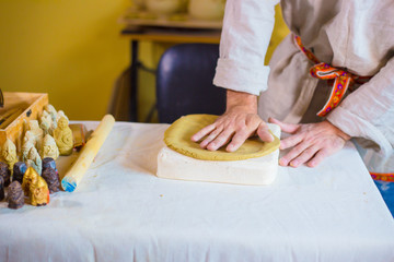 Potter making clay stamp picture